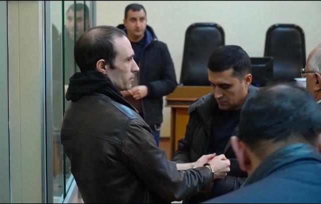(FILES) This grab taken from footage released by AFP video shows French national Martin Ryan (L) during a court hearing as part of his trial on spy charges in Baku on January 6, 2025. Azerbaijan on March 16, 2026 sentenced a French national Martin Ryan to 10 years in prison in an espionage case launched during a period of diplomatic tensions between Paris and Baku that have now eased. A court in Baku found Martin Ryan guilty of spying on Azerbaijan and handed him a 10-year jail term. Both Ryan and Paris reject the accusations. (Photo by AFPTV STRINGER / AFP)