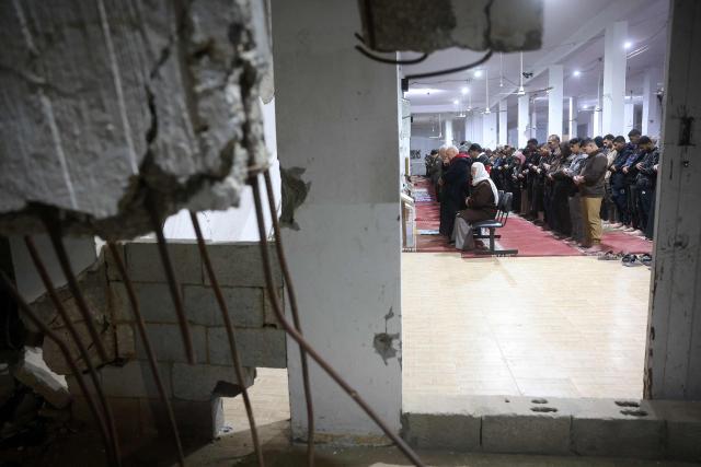 Muslims pray on Laylat al-Qadr (Night of Destiny) during the holy fasting month of Ramadan at the Mahaba Mosque which was previously damaged during the Israel-Hamas war in Khan Yunis in the southern Gaza Strip on March 16, 2026. Israel said it would partially reopen Gaza's Rafah crossing with Egypt this week, after it closed the key gateway when it launched a joint attack on Iran with the US. (Photo by Bashar Taleb / AFP)