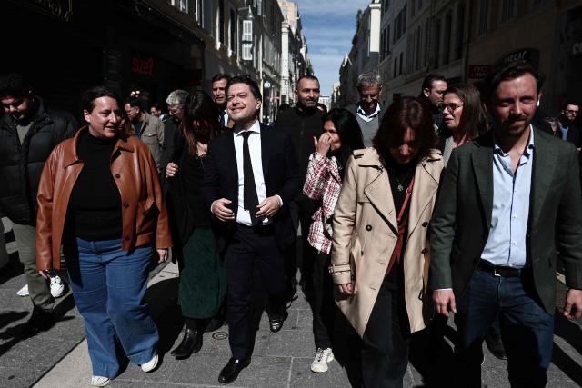 Marseille's incumbent mayor and broad left-wing coalition "Printemps Marseillais" candidate for re-election Benoit Payan (C) walks to the prefecture to submit a list, the day following the first round of France's 2026 municipal elections in Marseille, southern France, on March 16, 2026. (Photo by Thibaud MORITZ / AFP)