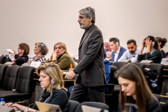 Iran's ambassador to the United Nations in Geneva Ali Bahreini leaves after delivering a speech following a report of the United Nations' Special Rapporteur on the situation of human rights in the Islamic Republic of Iran during a session of the UN Human Rights Council, in Geneva on March 16, 2026. (Photo by Fabrice COFFRINI / AFP)