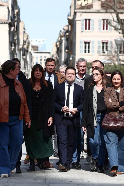 Marseille's outgoing deputy mayor Michèle Rubirola (C-L) and Marseille's incumbent mayor and broad left-wing coalition "Printemps Marseillais" candidate for re-election Benoit Payan (C-R) walk to the prefecture to submit a list, the day following the first round of France's 2026 municipal elections in Marseille, southern France, on March 16, 2026. (Photo by Thibaud MORITZ / AFP)
