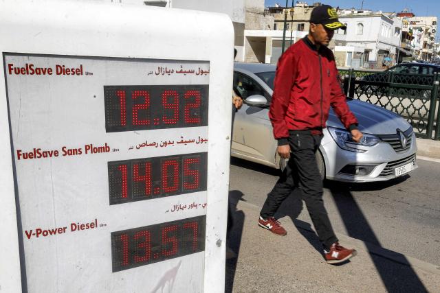 Fuel prices are displayed at a petrol station in Rabat on March 16, 2026, as prices hiked up in Morocco amid geopolitical tensions in the Middle East disrupting the global oil market. (Photo by Abdel Majid BZIOUAT / AFP)