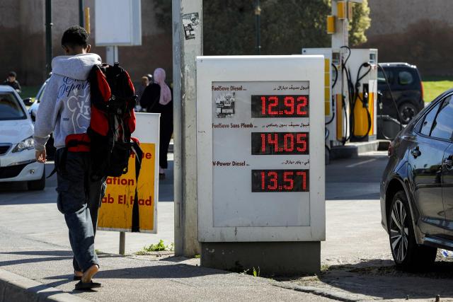 Fuel prices are displayed at a petrol station in Rabat on March 16, 2026, as prices hiked up in Morocco amid geopolitical tensions in the Middle East disrupting the global oil market. (Photo by Abdel Majid BZIOUAT / AFP)
