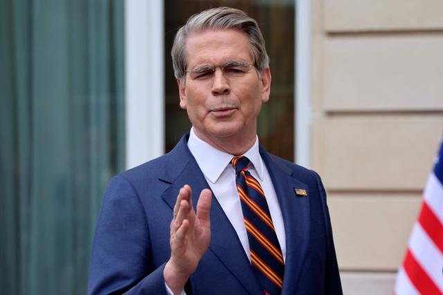 US Treasury Secretary Scott Bessent addresses journalists during a press statement with US Trade Representative Jamieson Greer (unseen) following a new round of trade discussions with Chinese officials at the OECD Headquarters in Paris on March 16, 2026. China and the United States agreed that stable bilateral economic trade relations were beneficial to both countries and the world, China's International Trade Representative told reporters. (Photo by Ludovic MARIN / AFP)