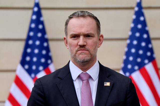 US Trade Representative Jamieson Greer addresses journalists during a press statement with US Treasury Secretary Scott Bessent (unseen) following a new round of trade discussions with Chinese officials at the OECD Headquarters in Paris on March 16, 2026. China and the United States agreed that stable bilateral economic trade relations were beneficial to both countries and the world, China's International Trade Representative told reporters. (Photo by Ludovic MARIN / AFP)