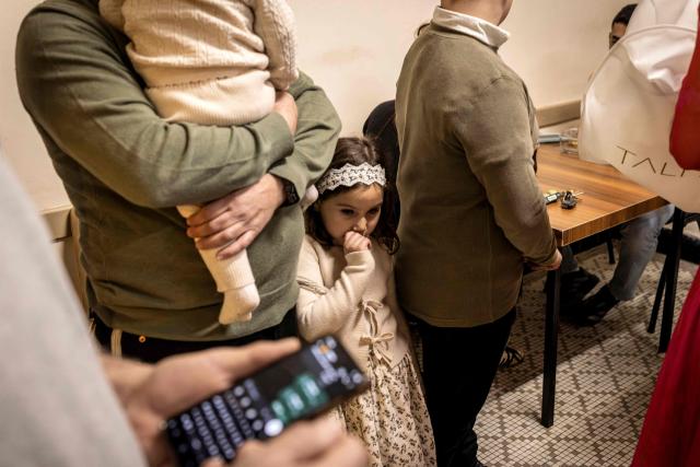 Wedding guests sit in a bomb shelter after sirens wailed of an impending projectile attack in Jerusalem on March 16, 2026. On February 28, Israel and the United States launched strikes on Iran, killing its supreme leader Ayatollah and triggering a war that spread across the Middle East. (Photo by JOHN WESSELS / AFP)