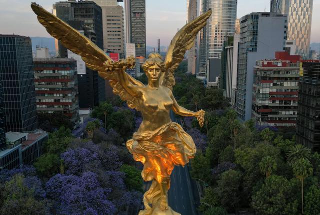 Aereal view of the Victoria Alada (Winged Victory, known as the Angel of Independence) at the Reforma Avenue in Mexico City on March 16, 2026. (Photo by Alfredo ESTRELLA / AFP)