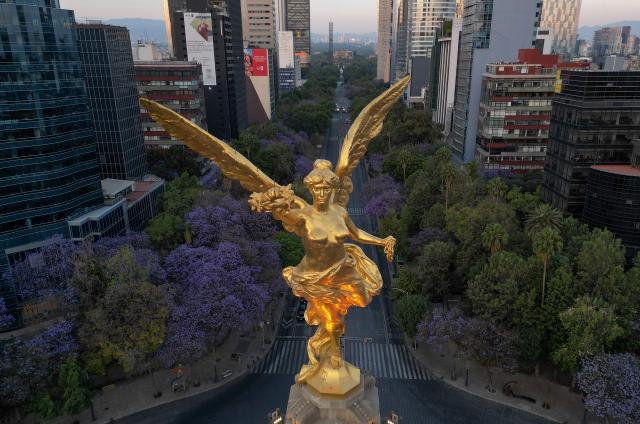 Aereal view of the Victoria Alada (Winged Victory, known as the Angel of Independence) at the Reforma Avenue in Mexico City on March 16, 2026. (Photo by Alfredo ESTRELLA / AFP)