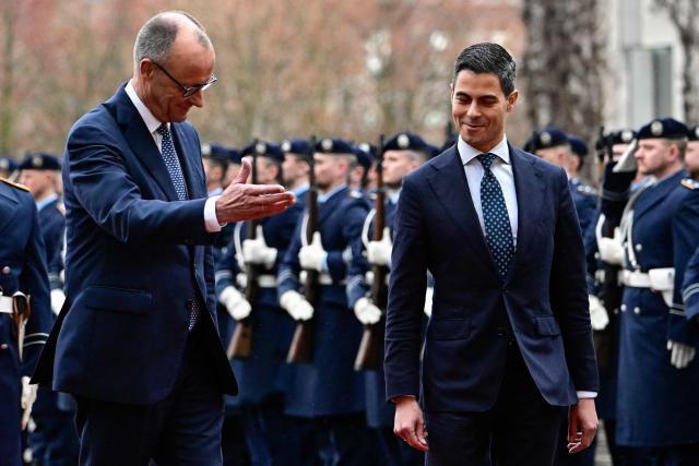 German Chancellor Friedrich Merz (L) shows the way to Netherlands' Prime Minister Rob Jetten during an official welcoming ceremony at the chancellery in Berlin, on March 16, 2026 (Photo by Tobias SCHWARZ / AFP)