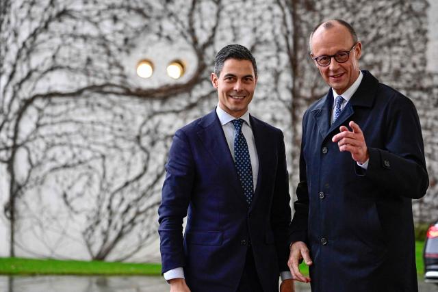 German Chancellor Friedrich Merz (R) greets Netherlands' Prime Minister Rob Jetten as he arrives at the chancellery in Berlin, on March 16, 2026 (Photo by Tobias SCHWARZ / AFP)