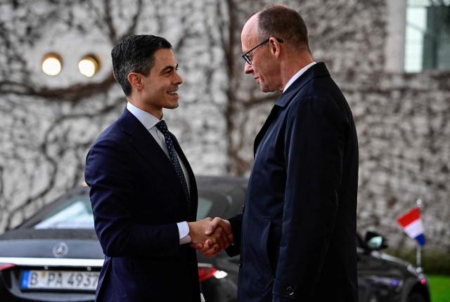German Chancellor Friedrich Merz (R) greets Netherlands' Prime Minister Rob Jetten as he arrives at the chancellery in Berlin, on March 16, 2026 (Photo by Tobias SCHWARZ / AFP)