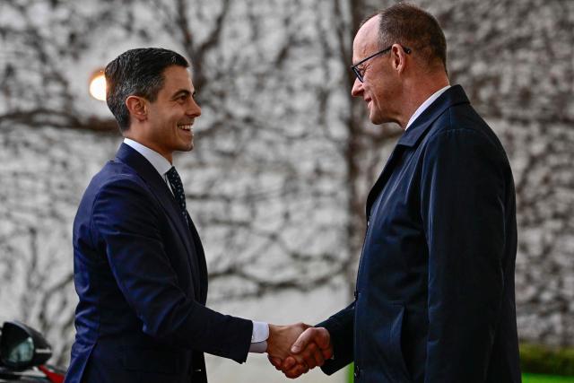 German Chancellor Friedrich Merz (R) greets Netherlands' Prime Minister Rob Jetten as he arrives at the chancellery in Berlin, on March 16, 2026 (Photo by Tobias SCHWARZ / AFP)