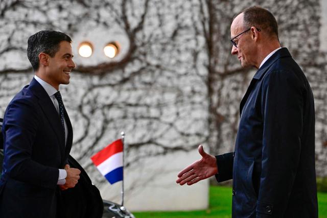 German Chancellor Friedrich Merz (R) greets Netherlands' Prime Minister Rob Jetten as he arrives at the chancellery in Berlin, on March 16, 2026 (Photo by Tobias SCHWARZ / AFP)