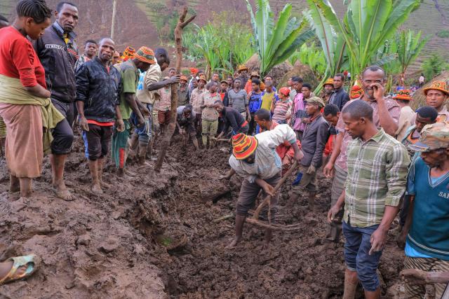 TOPSHOT - Residents dig at the scene of a landslide in Mazo Doysa in the Gacho Baba woreda of the Gamo Zone on March 13, 2026. Ethiopia's parliament on March 13, 2026 declared three days of national mourning as the death toll from floods and landslides in the southern Gamo region rose to 80, with many still missing.
Torrential rains this week in the remote Gamo zone have caused massive destruction. (Photo by Yaekob Geja / AFP)