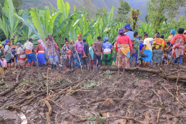 Residents gather at the scene of a landslide in Mazo Doysa in the Gacho Baba woreda of the Gamo Zone on March 13, 2026. Ethiopia's parliament on March 13, 2026 declared three days of national mourning as the death toll from floods and landslides in the southern Gamo region rose to 80, with many still missing.
Torrential rains this week in the remote Gamo zone have caused massive destruction. (Photo by Yaekob Geja / AFP)