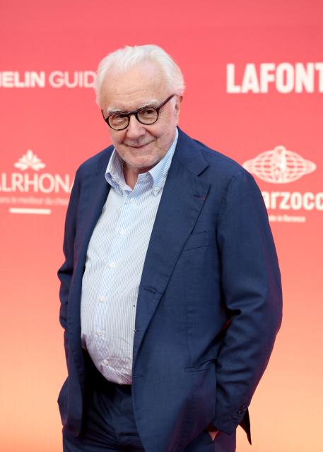 French chef Alain Ducasse poses upon arrival to attend the 2026 Michelin Guide award winners ceremony in Monaco on March 16, 2026. (Photo by Valery HACHE / AFP)