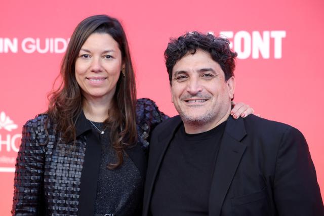 Argentine chef Mauro Colagreco (R) and his wife Julia Colagreco (L) pose upon arrival to attend the 2026 Michelin Guide award winners ceremony in Monaco on March 16, 2026. (Photo by Valery HACHE / AFP)