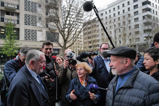 Lyon's mayoral candidate, whose list is supported by right-wing Les Republicains (LR) party and centrist party Renaissance, Jean-Michel Aulas (L) speaks to inhabitants as part of his campaign for the second round of France's 2026 local elections in Lyon, central-eastern France, on March 16, 2026. Long considered the frontrunner in the polls for the Lyon mayoral election, the former Olympique Lyonnais President said he was "disappointed" on March 15, 2026 to find himself neck and neck with Green Party mayor in the first round, ahead of the La France Insoumise (LFI) candidate in third. (Photo by OLIVIER CHASSIGNOLE / AFP)