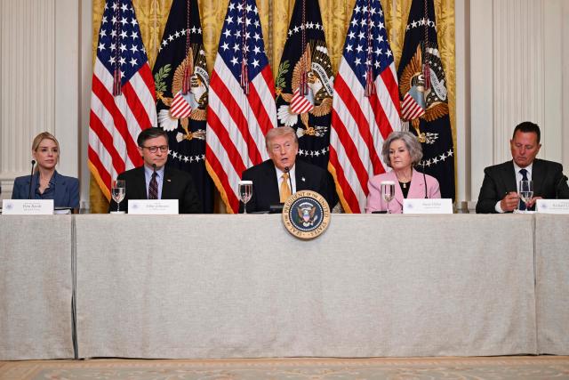 US President Donald Trump joined by US Attorney General Pam Bondi,  US Speaker of the House Mike Johnson (L), Republican from Louisiana, White House Chief of Staff Susie Wiles
and Richard Grenell, outgoing President of The Kennedy Center Board of Trustees, speaks during a lunch with the Kennedy Center Board Members in the East Room of the White House on March 16, 2026 in Washington, DC. (Photo by Annabelle GORDON / AFP)