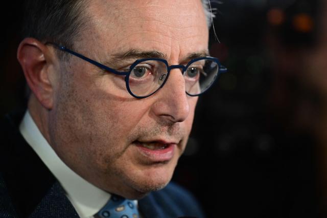 Belgium's Prime Minister Bart De Wever talks to the press at a reception of the VBO/ FEB Federation of Enterprises in Belgium, in Brussels on March 16, 2026. (Photo by DIRK WAEM / Belga / AFP) / Belgium OUT