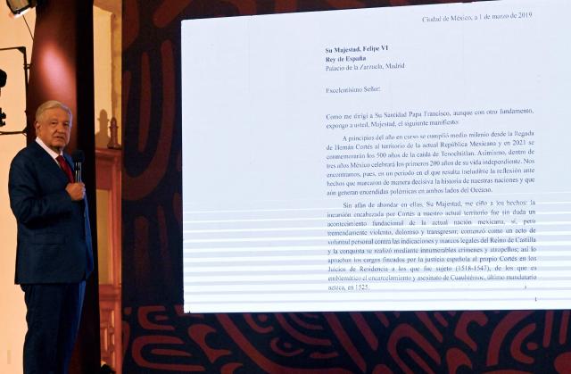 (FILES) Former Mexican President Andres Manuel Lopez Obrador reads a letter from 2019 addressed to Felipe VI, King of Spain, in which he requests for the Spanish crown to recognise 'grievances' committed during the conquest, during his daily conference at the National Palace in Mexico City on September 26, 2024. Spain's King Felipe VI admitted on March 16, 2026 that there has been a lot of "abuse" during the Spanish conquest of America. (Photo by ALFREDO ESTRELLA / AFP)