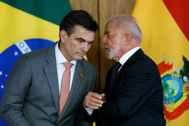 Bolivia's President Rodrigo Paz (L) listens to Brazil's President Luiz Inacio Lula da Silva during a meeting at Planalto Palace in Brasilia, on March 16, 2026. According to the Brazilian government, the meeting will focus on energy, integration, and trade. (Photo by Sergio Lima / AFP)
