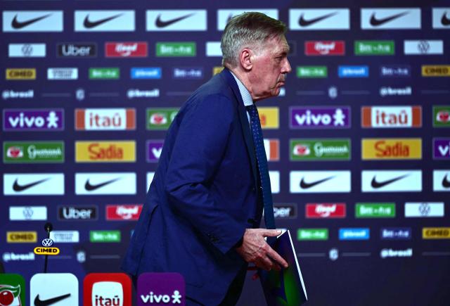Brazil's national football team coach Italian Carlo Ancelotti leaves after a press conference to announce the squad for the international friendlies against France and Croatia in Rio de Janeiro, Brazil on March 16, 2026. (Photo by Pablo PORCIUNCULA / AFP)
