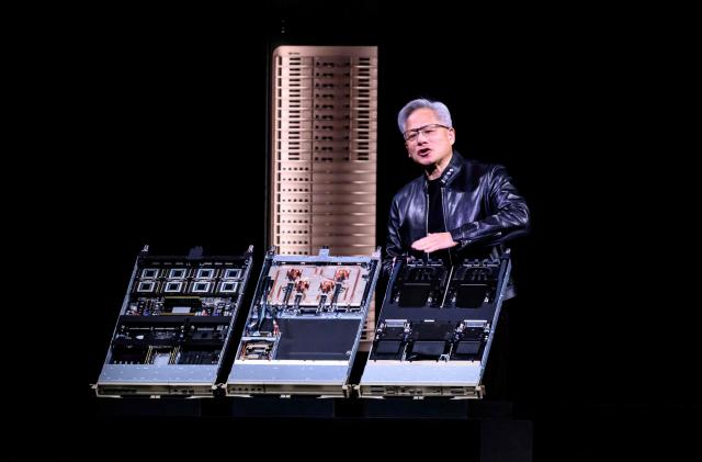 Nvidia CEO Jensen Hwang introduces Vera Rubin, a next-generation AI data center platform, and Rubin Ultra,  a next-generation AI GPU architecture, during the keynote address at the company's annual GTC developers conference in San Jose, California, on March 16, 2026. (Photo by JOSH EDELSON / AFP)