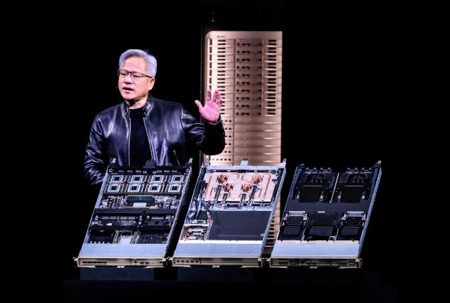 Nvidia CEO Jensen Hwang introduces Vera Rubin, a next-generation AI data center platform, and Rubin Ultra,  a next-generation AI GPU architecture, during the keynote address at the company's annual GTC developers conference in San Jose, California, on March 16, 2026. (Photo by JOSH EDELSON / AFP)