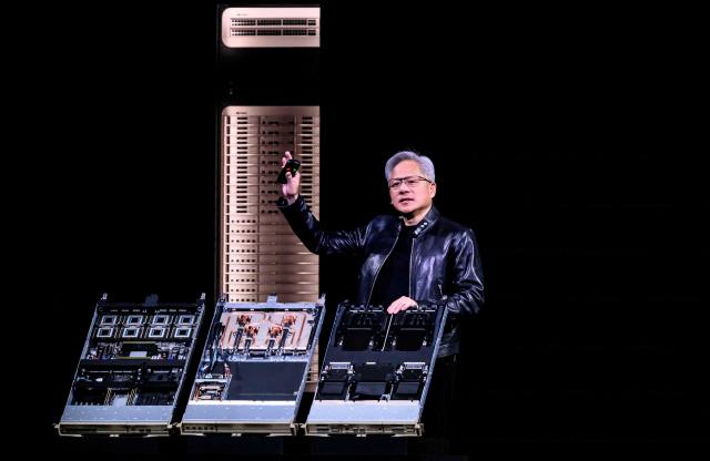 Nvidia CEO Jensen Hwang introduces Vera Rubin, a next-generation AI data center platform, and Rubin Ultra,  a next-generation AI GPU architecture, during the keynote address at the company's annual GTC developers conference in San Jose, California, on March 16, 2026. (Photo by JOSH EDELSON / AFP)