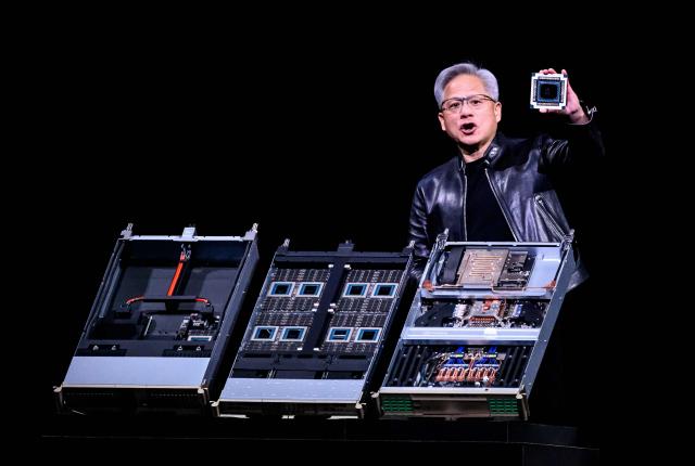 Nvidia CEO Jensen Hwang introduces Vera Rubin, a next-generation AI data center platform, and Rubin Ultra,  a next-generation AI GPU architecture, during the keynote address at the company's annual GTC developers conference in San Jose, California, on March 16, 2026. (Photo by JOSH EDELSON / AFP)
