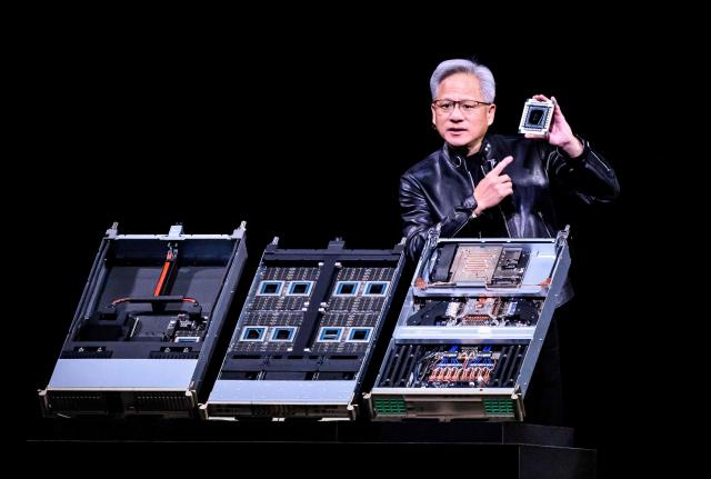 Nvidia CEO Jensen Hwang introduces Vera Rubin, a next-generation AI data center platform, and Rubin Ultra,  a next-generation AI GPU architecture, during the keynote address at the company's annual GTC developers conference in San Jose, California, on March 16, 2026. (Photo by JOSH EDELSON / AFP)