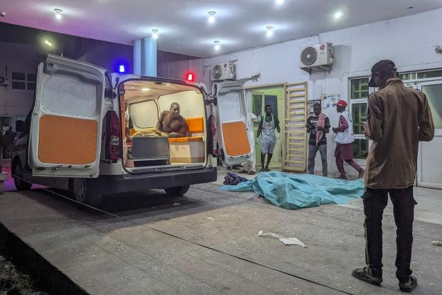 TOPSHOT - An injured man looks out of an ambulance at a hospital in Maiduguri on March 16, 2026 following blasts in the city. Multiple explosions rocked the northeastern Nigerian city of Maiduguri in the evening of March 16, 2026, government and healthcare sources told AFP, on the back of an overnight attack on a military post.
Earlier, suspected jihadists launched an attack on a Nigerian military post on the outskirts of Maiduguri, a key northeastern city that had not seen such violence in years. (Photo by AFP)