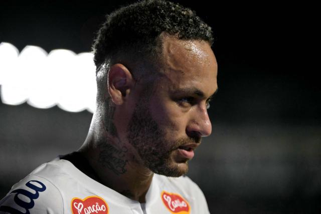 (FILES) Santos' forward Neymar #10 looks on during the Campeonato Paulista football match between Santos and Botafogo de Ribeirao Preto at the Urbano Caldeira Stadium in Santos, Sao Paulo state, Brazil on February 5, 2025. Brazil coach Carlo Ancelotti said on March 16, 2026 Neymar is "not 100 percent" fit so will miss two friendlies later this month as youngster Endrick returns to the squad. Santos' Neymar has not played for Brazil since October 2023 due to a serious knee injury but has played four games for his club since mid-February. (Photo by NELSON ALMEIDA / AFP)