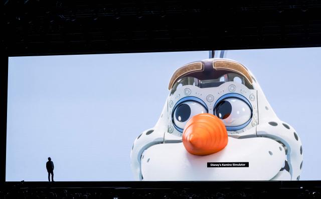 Nvidia CEO Jensen Huang watches a Disney animation video during his keynote address at the company's annual GTC developers conference at the SAP Center in San Jose, California, on March 16, 2026. (Photo by JOSH EDELSON / AFP)