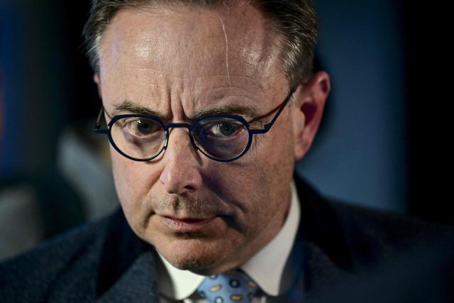 Belgium's Prime Minister Bart De Wever tlooks on during a reception of the VBO/ FEB Federation of Enterprises in Belgium, in Brussels on March 16, 2026. (Photo by DIRK WAEM / Belga / AFP) / Belgium OUT