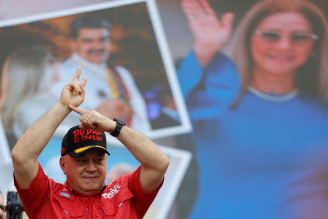(FILES) Venezuela's Minister of the Interior and Justice, Diosdado Cabello, gestures during a demonstration by supporters of ousted President Nicolas Maduro calling for the release of him and his wife from a US prison in Caracas on January 23, 2026. The powerful Venezuelan minister Diosdado Cabello denied on March 16, 2026, that Chavismo is “cornered” following the U.S. military operation in which Nicolбs Maduro was captured and which led the government to yield to Washington's demands. (Photo by Pedro MATTEY / AFP)