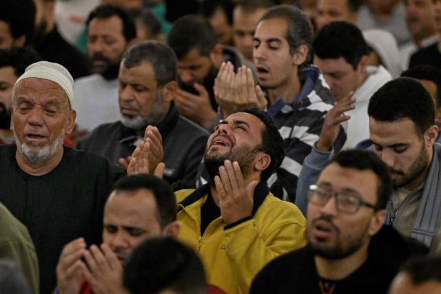 Muslims chant the Tarawih recitations on the occasion of Laylat al-Qadr which falls on the 27th day of the fasting month of Ramadan, at Cairo's Amr Ibn al-Aas mosque late on March 16, 2026. Laylat al-Qadr, or Night of Destiny, marks the night Muslims believe the first verses of the Koran were revealed to the Prophet Mohammed through the archangel Gabriel. (Photo by Khaled DESOUKI / AFP)