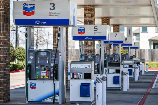 Gasoline prices are seen at a Chevron gas station in Houston, Texas, on March 16, 2026. Oil prices retreated and equities rose Monday as investors remained focused on the Strait of Hormuz, with US allies pushing back against President Donald Trump's demands to help reopen the key waterway to oil and natural gas tankers. (Photo by RONALDO SCHEMIDT / AFP)