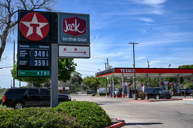 Gasoline prices are seen at a Texaco gas station in Houston, Texas, on March 16, 2026. Oil prices retreated and equities rose Monday as investors remained focused on the Strait of Hormuz, with US allies pushing back against President Donald Trump's demands to help reopen the key waterway to oil and natural gas tankers. (Photo by RONALDO SCHEMIDT / AFP)