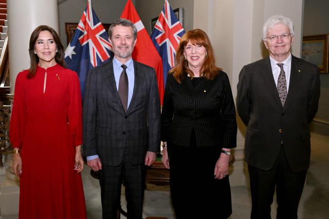 Denmark's King Frederik X (2/L) and Queen Mary (L) pose for photos with Victoria's Governor Margaret Garner (2/R)  and her husband Professor Glyn Davis (R) after signing the guest book at Government House in Melbourne on March 17, 2026. (Photo by William WEST / POOL / AFP)