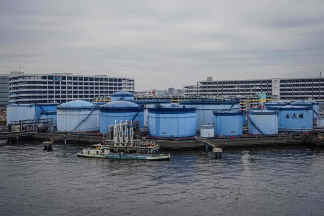 An oil tanker is moored at an oil terminal in Yokohama, Kanagawa prefecture on March 17, 2026. Oil prices resumed their push higher on March 17 as several countries pushed back against Donald Trump's demand that they help secure the key Strait of Hormuz, while Iran continued to target crude-producing neighbours. (Photo by Yuichi YAMAZAKI / AFP)