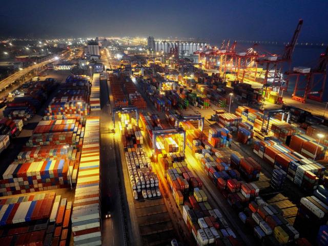 Cargo containers are seen at the terminal in Lianyungang, eastern China's Jiangsu province on March 17, 2026. (Photo by CN-STR / AFP) / China OUT