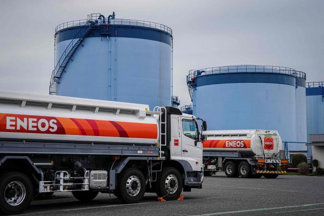 Tank lorries are seen at an oil terminal in Yokohama, Kanagawa prefecture on March 17, 2026. Oil prices resumed their push higher on March 17 as several countries pushed back against Donald Trump's demand that they help secure the key Strait of Hormuz, while Iran continued to target crude-producing neighbours. (Photo by Yuichi YAMAZAKI / AFP)