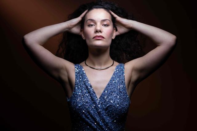 (FILES) French-Algerian soprano Tamara Bounazou poses during a photo session in Paris on March 10, 2026. She sees herself as a "spellcaster": soprano Tamara Bounazou, a rising star, lives her passion for opera on stage and on a streaming platform, where she is eager to share her art. The 30-year-old French-Algerian singer is nominated in the "Opera Singer Revelation" category at the Victoires de la Musique Classique awards ceremony, which will take place on March 20, 2026 in Brest, alongside Léontine Maridat-Zimmerlin and Lucie Peyramaure. (Photo by JOEL SAGET / AFP)