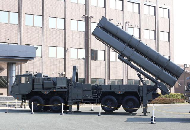 A launch vehicle for the long-range Type 12 Surface-to-Ship Guided Missile is unveiled by the Ministry of Defense’s Kyushu Defense Bureau at the Japan Ground Self-Defense Force’s Kengun Garrison in Kumamoto City on March 17, 2026, ahead of its initial domestic deployment. (Photo by JIJI PRESS / AFP) / Japan OUT