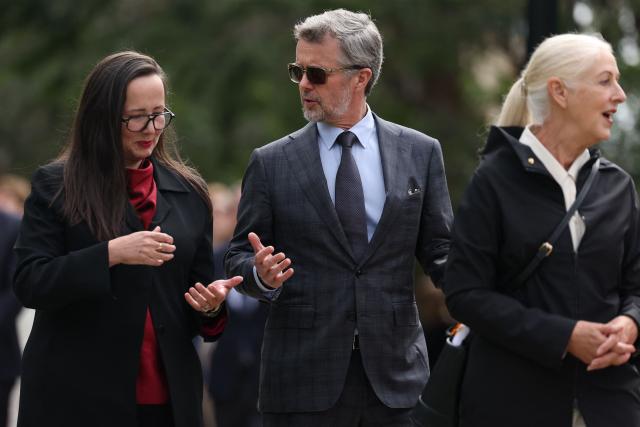 Denmark's King Frederik X (C) talks with Victoria State Minister Harriet Shing as he visits the Prahan redevelopment project and walks to Sophia at The Prahran Arcade in Melbourne on March 17, 2026. (Photo by Martin Keep / POOL / AFP)