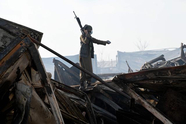 A Taliban security personnel inspects the site after Pakistani airstrikes hit the Secondary Rehabilitation Services Centre in Kabul on March 17, 2026. Heavy casualties were feared on March 17 after Afghanistan accused Pakistan of hitting a treatment centre for drug addicts in the capital, Kabul, and killing civilians. Pakistan denied deliberately targeting the facility, instead saying it had conducted precision strikes on "military installations and terrorist support infrastructure". (Photo by Wakil KOHSAR / AFP)
