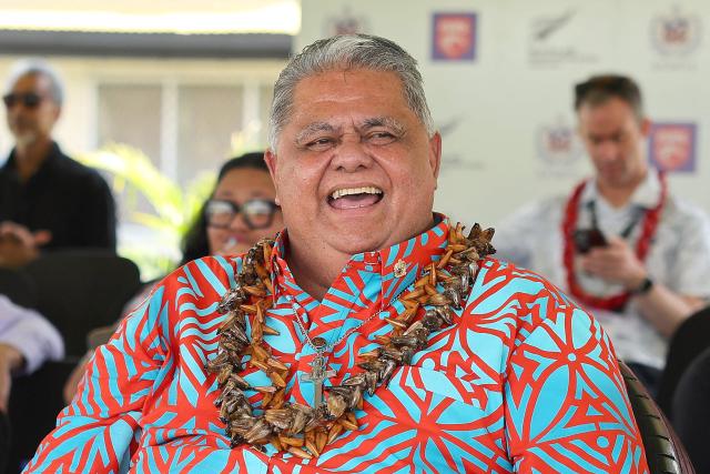 Samoan counterpart, La'aulialemalietoa Leuatea Schmidt watches a rugby match between Auckland’s Tipene College and Samoa’s Wesley College with his New Zealand counterpart Christopher Luxon in the village of Faleula, Samoa, on March 17, 2026. (Photo by Ben STRANG / AFP)