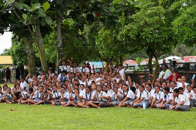 Students cheer during the Prime Ministers cup rugby match between Samoa’s Wesley College and Auckland’s Tipene College in the village of Faleula, Samoa, on March 17, 2026. (Photo by Ben STRANG / AFP)